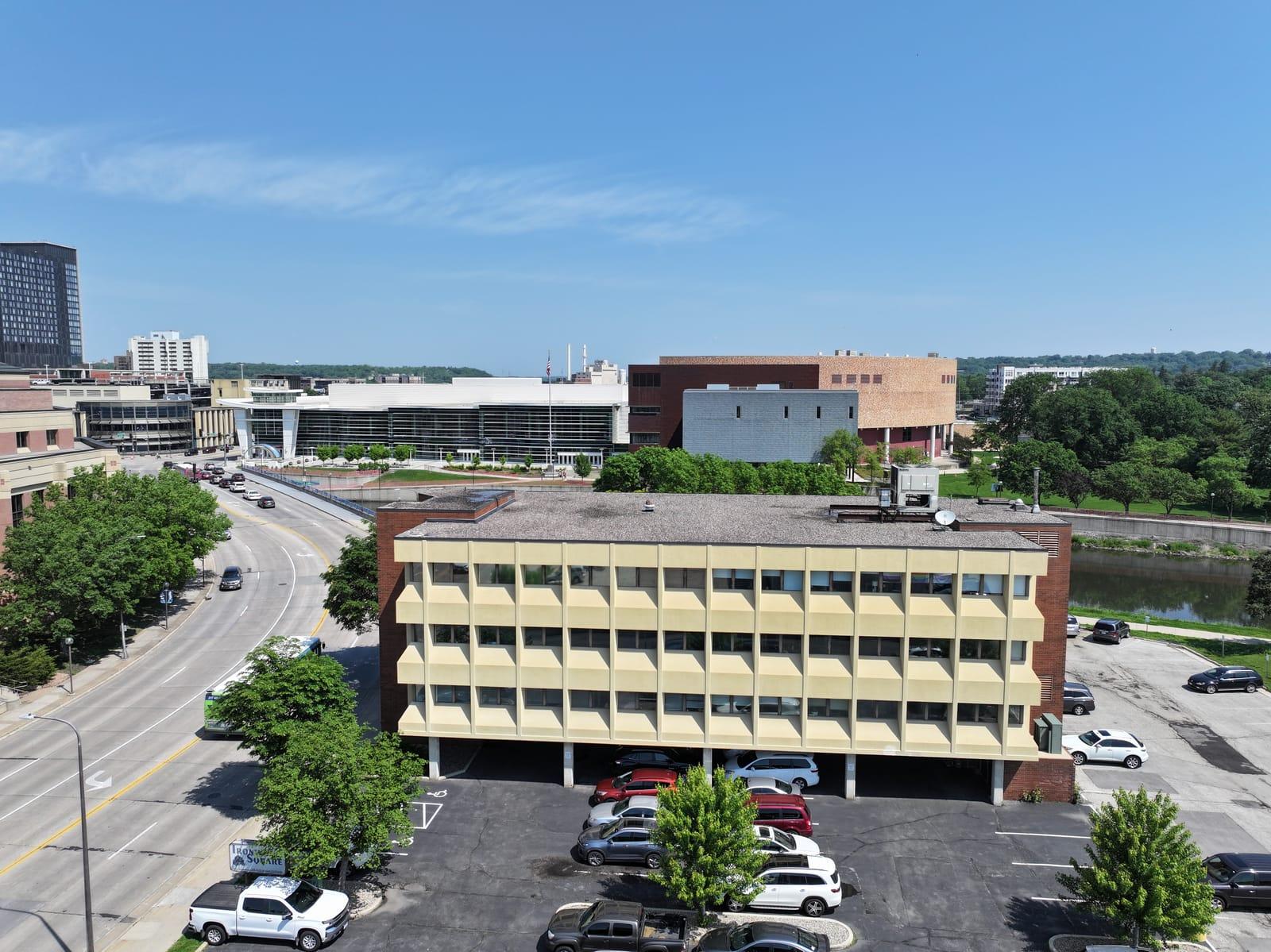 Ironwood Square raised on structural columns beside the Zumbro River in downtown Rochester