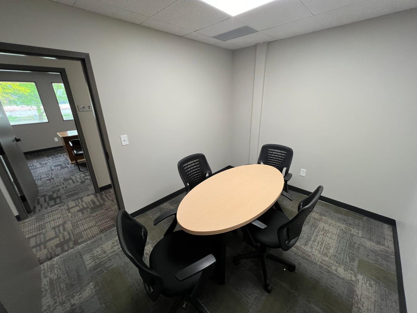 A small round-table meeting room at Ironwood Square